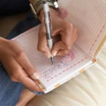 A woman filling out her yes no maybe lists.