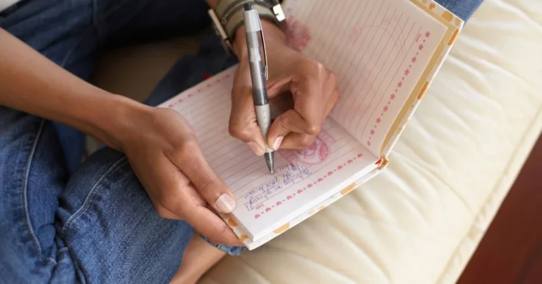 A woman filling out her yes no maybe lists.