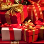 A festive background with BDSM Christmas gifts beneath a tree.