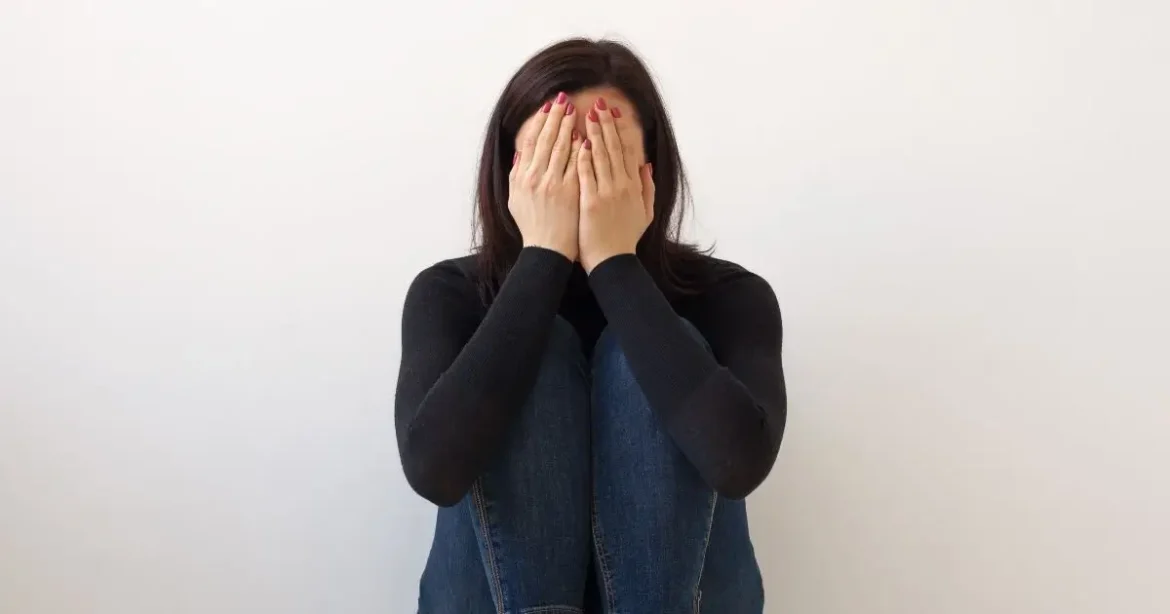 Navigating Guilt and Self-Doubt in BDSM: Support for Dominants and Submissives A young woman struggling with guilt and self-doubt in BDSM.