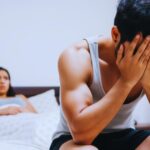 A couple in bed arguing because one person is kinkier than the other